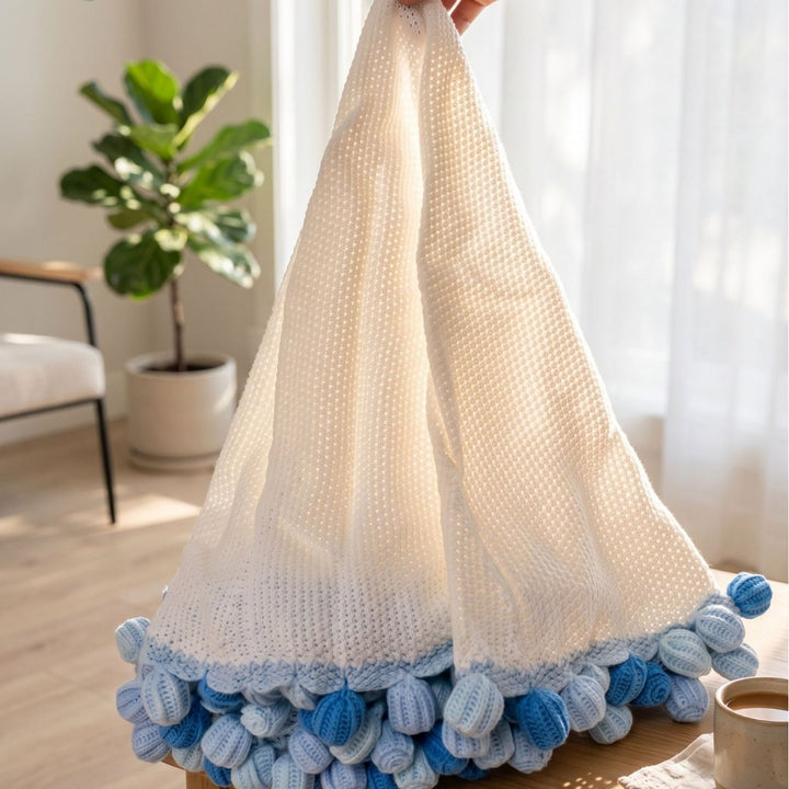 Pom-Pom Strickwurfdecke