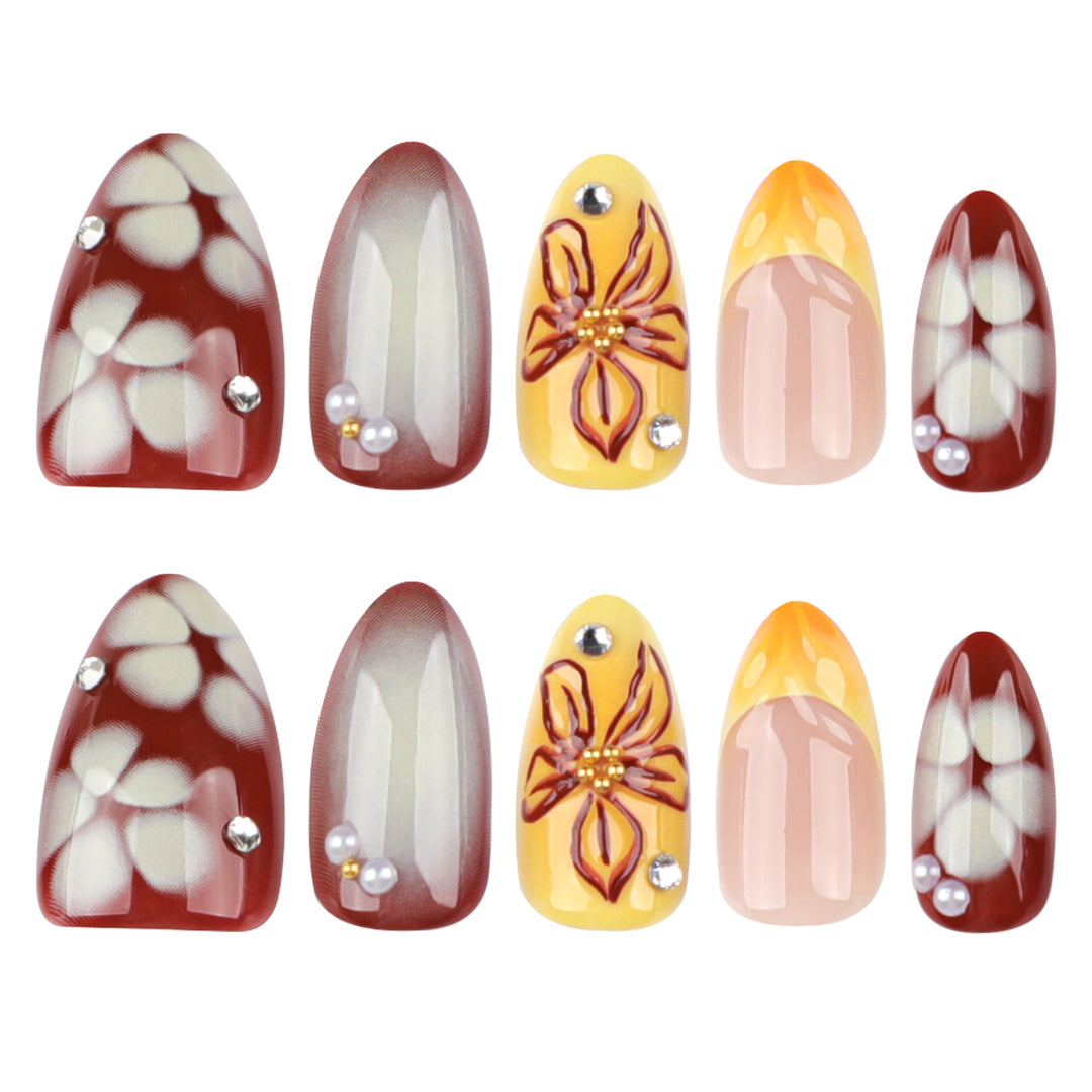 Künstliche Nagelverlängerungen mit floralem Design und Strassverzierungen Karnz