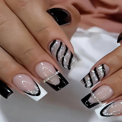 Kunstnagelset mit glamourösen Glitzer- und Streifendesigns Karnz