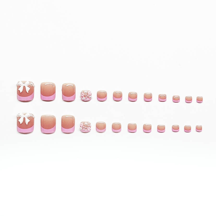 Dekorativer Press-On Nagelkunst Set mit floralen und Schleifenakzenten Karnz