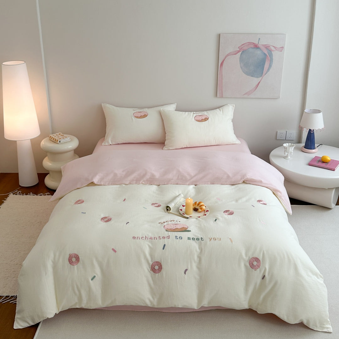 Baumwoll-Bettwäsche-Set mit gesticktem Donut-Motiv und Kissenbezügen Karnz