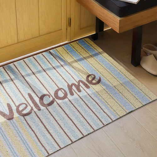 Gewebte Türmatte mit Welcome‑Schriftzug, Streifenmuster und rutschfester Rückseite