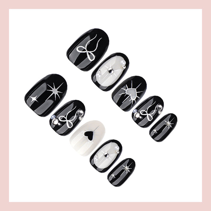 Kunstnagelset mit elegantem Schleifen- und Herzdesign Karnz