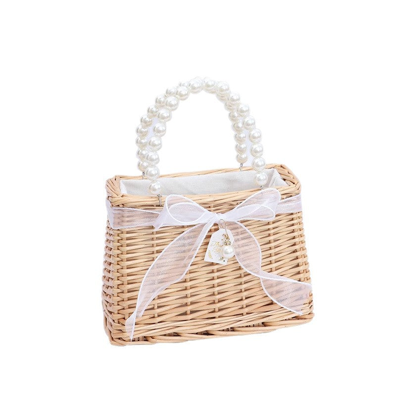 Damen Handtasche aus geflochtenem Material mit eleganten Perlengriffen Karnz
