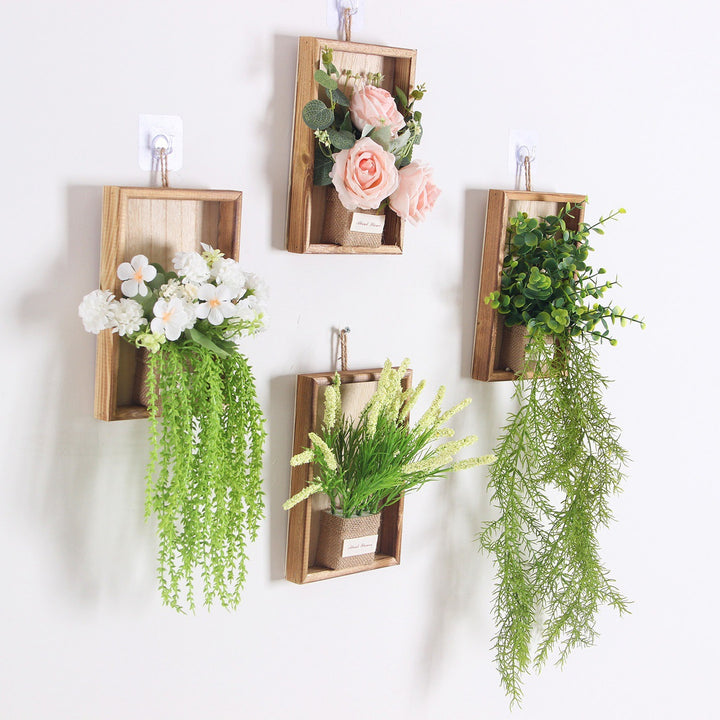 Wandmontierte dekorative florale hängende Pflanzgefäß