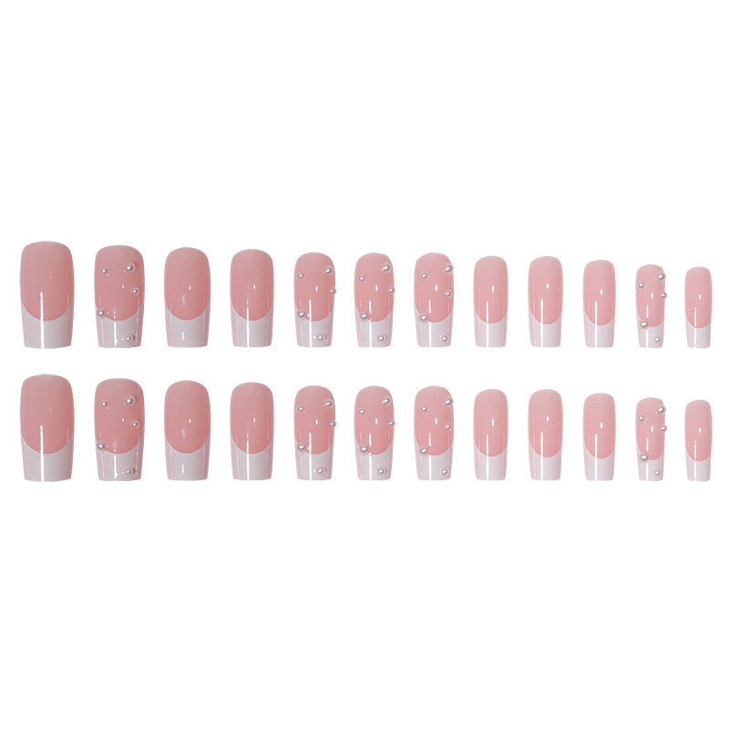 Kunstnagelset mit exquisiten Perlenakzenten und transparentem Design Karnz