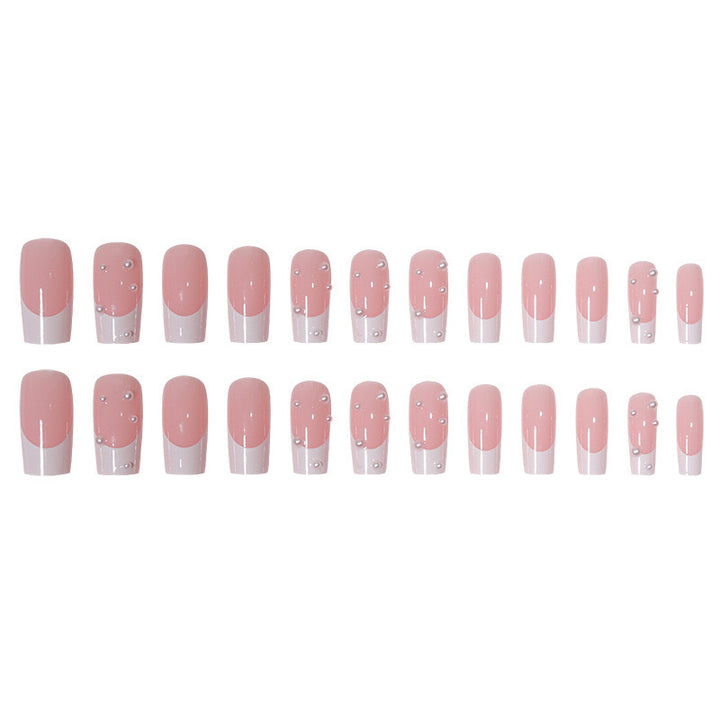 Kunstnagelset mit exquisiten Perlenakzenten und transparentem Design Karnz