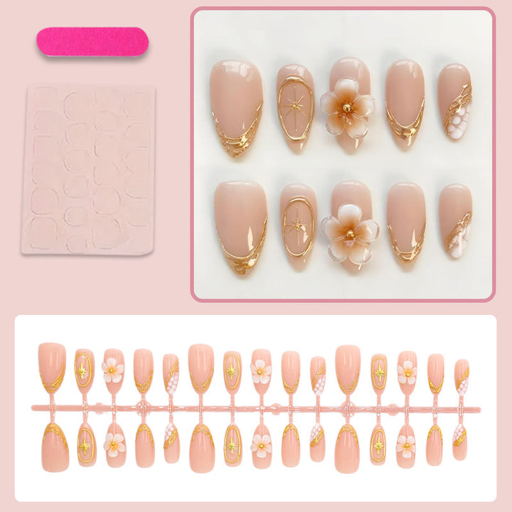 Kunstnagelset mit eleganten Blumen- und Goldverzierungen Karnz