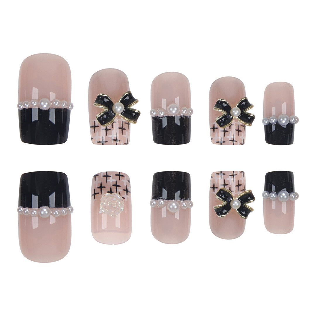 Dekoratives Press-On-Nagelset mit eleganten Schleifenakzenten Karnz
