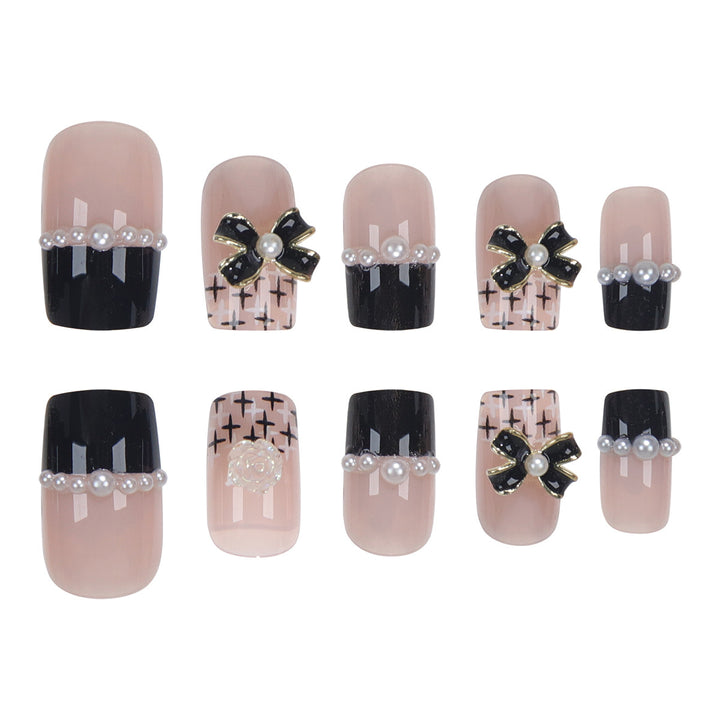 Dekoratives Press-On-Nagelset mit eleganten Schleifenakzenten Karnz
