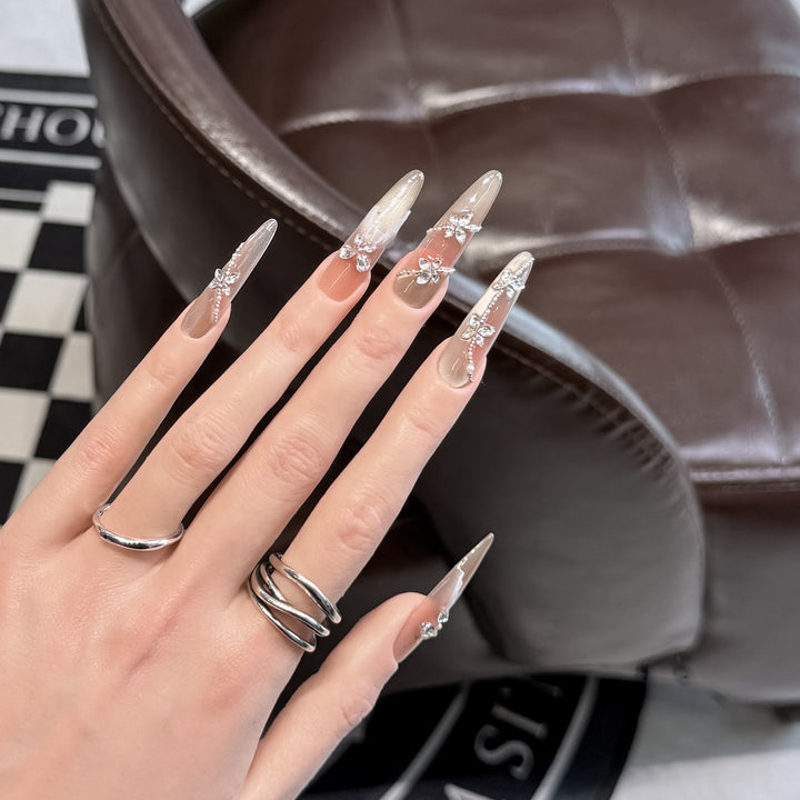 Dekorative Strass-besetzte Stiletto Druck-Nagelset Karnz