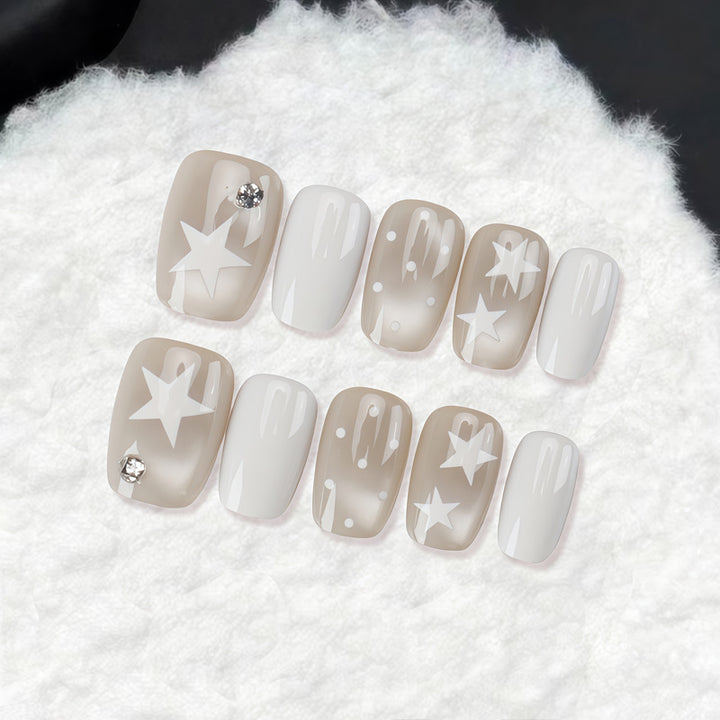 Dekoratives Press-On-Nagelset mit Stern- und Schleifenmotiven Karnz