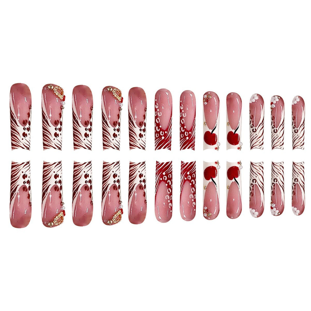 Dekorative Lange Press-On Nagelkunst mit Edelsteinakzenten Karnz