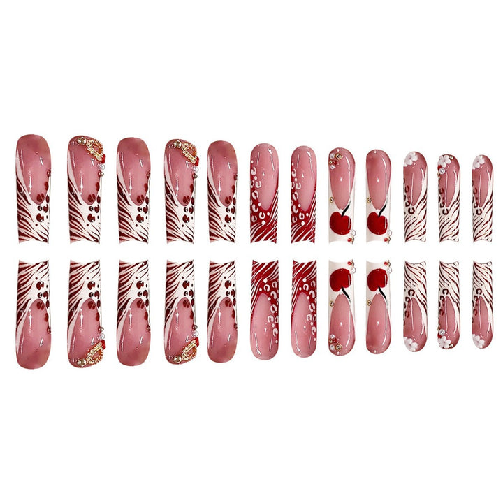 Dekorative Lange Press-On Nagelkunst mit Edelsteinakzenten Karnz