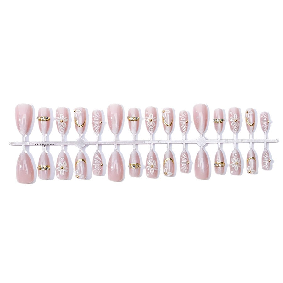 Elegantes Kunstnagelset mit Blumen- und Glitzerelementen Karnz