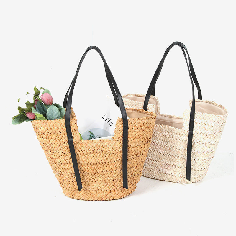 Damen Handtasche aus geflochtenem Naturmaterial mit eleganten Ledergriffen Karnz