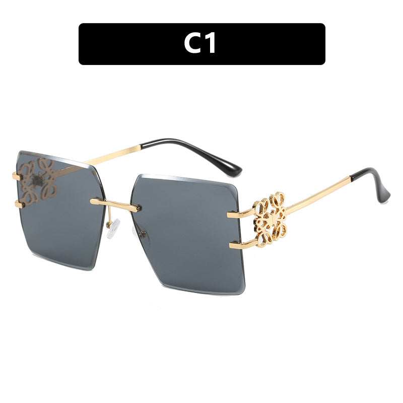 Damen modische Sonnenbrille mit außergewöhnlichem Design und goldenen Akzenten Karnz