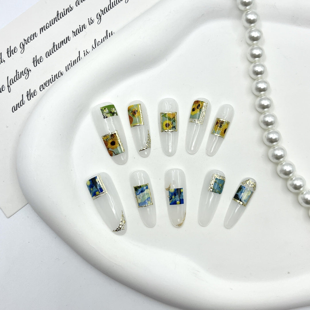 Künstlerisches Press-On Nagelset mit floralen und landschaftlichen Designs