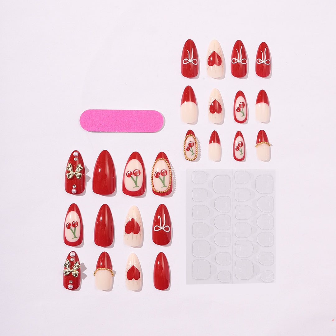 Kreatives Kunstnagelset mit eleganten Herz- und Schleifenmotiven Karnz