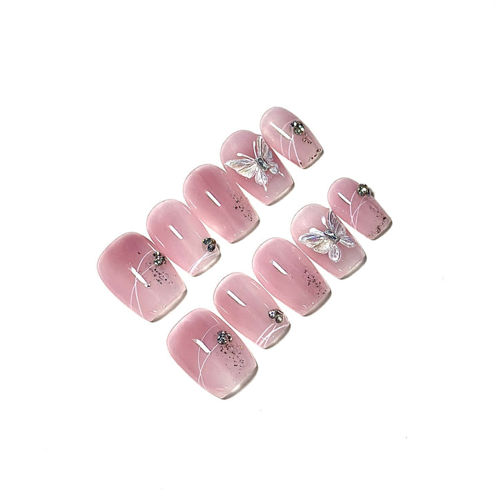 Elegantes Press-On Nagelkunstset mit Schmetterlings- und Edelsteinverzierungen