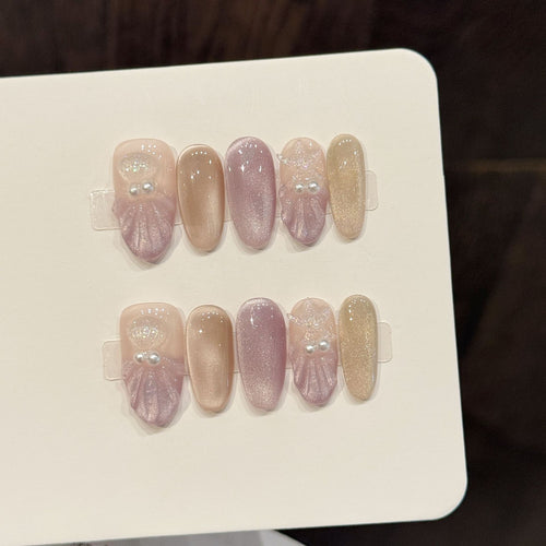 Elegantes dekoratives Press-On-Nagelkunstset mit Perlen- und Glitzerakzenten