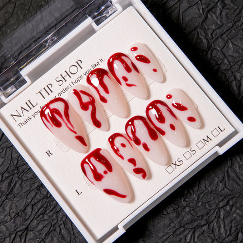 Künstlerisches Press-On Nagelset mit Blutspritzdesign
