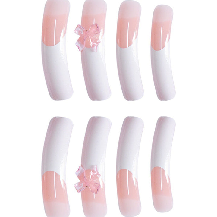 Elegante Nagelkunstverzierungen mit dekorativen Schleifenakzenten Karnz
