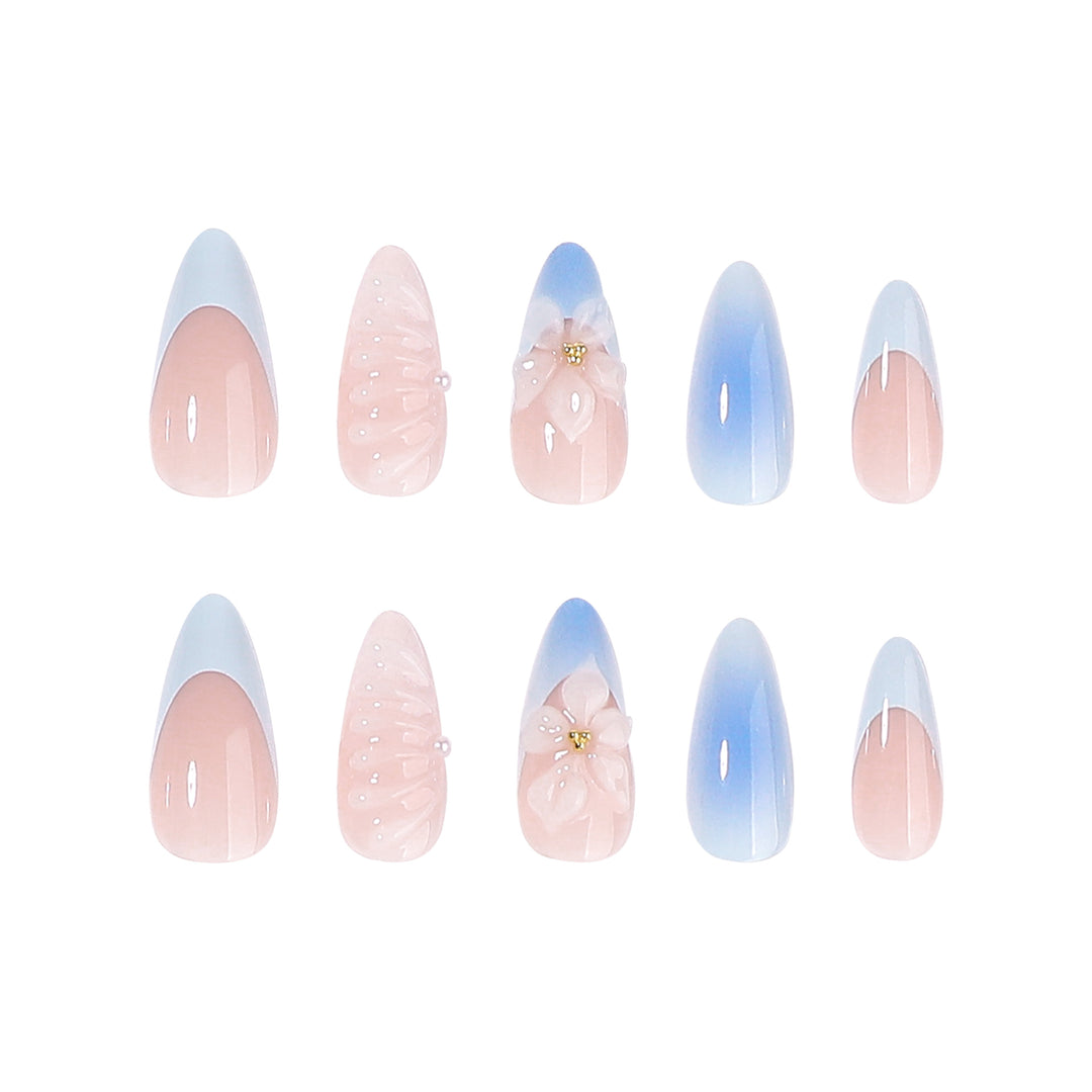 Stiletto-Nägel mit floralem Design und Glitzer Akzenten Karnz