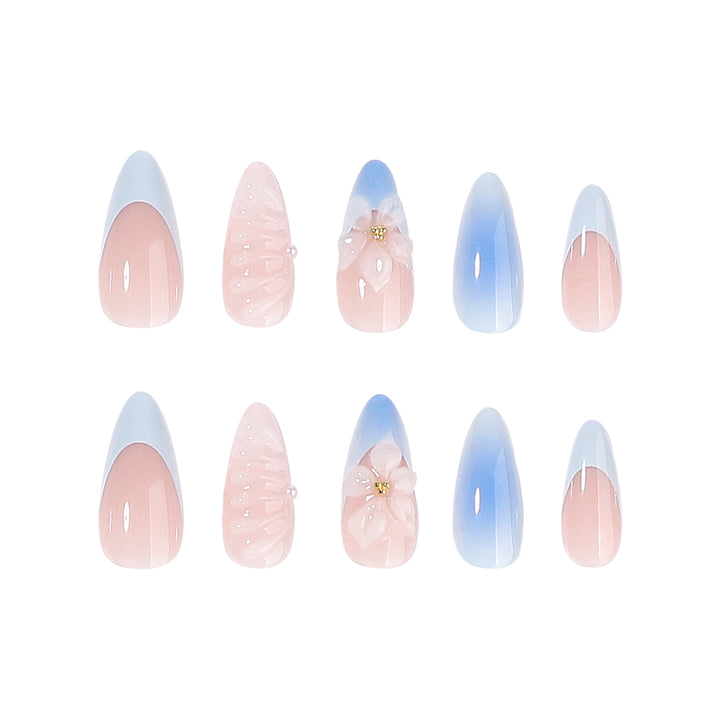 Stiletto-Nägel mit floralem Design und Glitzer Akzenten Karnz