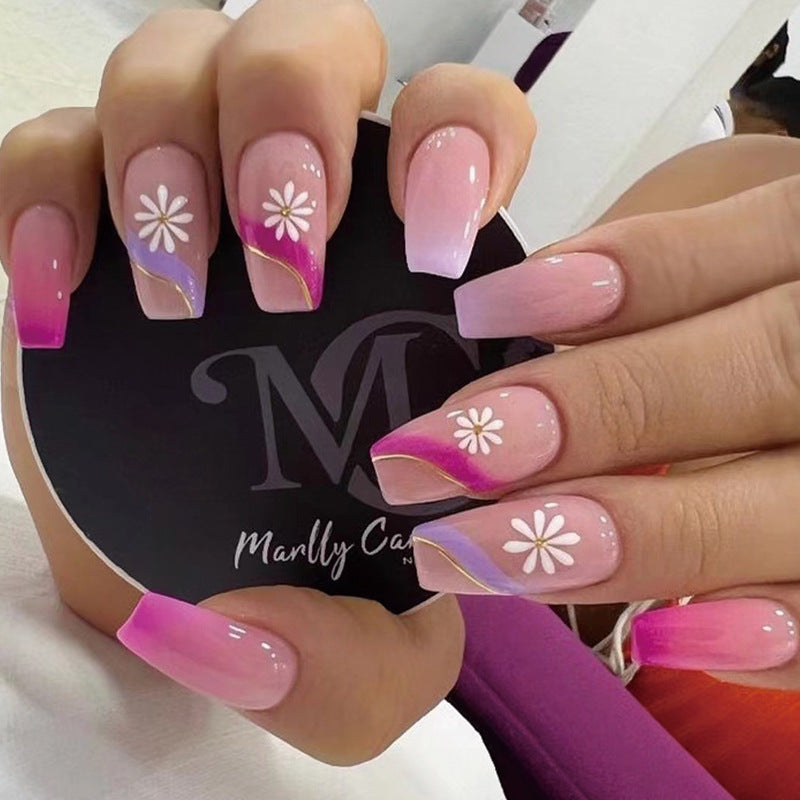 Kunstvolle Nagelverlängerungen mit buntem Ombre-Design und floralen Akzenten Karnz