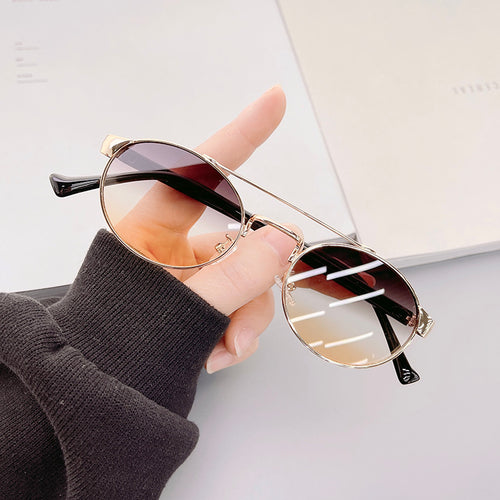 Damen modische Sonnenbrille im stilvollen runden Design mit goldenen Akzenten Karnz