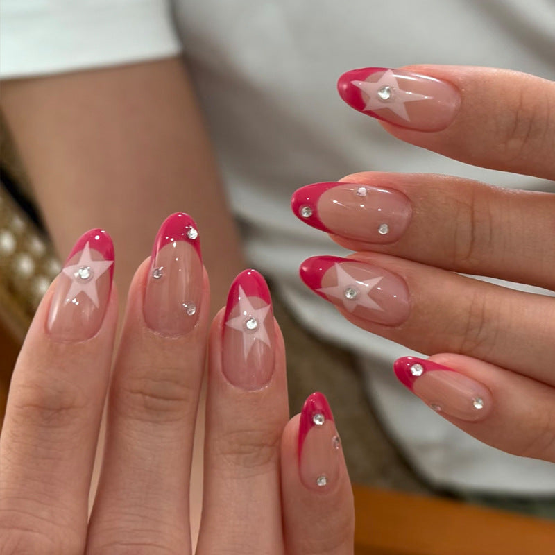 Elegantes Press-On-Nageldesign mit Stern- und Strassakzenten Karnz