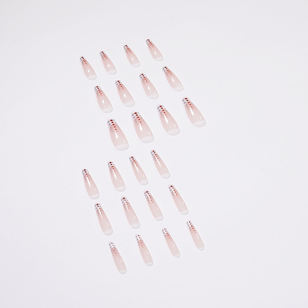 Kunstvolle Nagelverlängerungen mit eleganten Dots und schimmerndem Ombré Karnz
