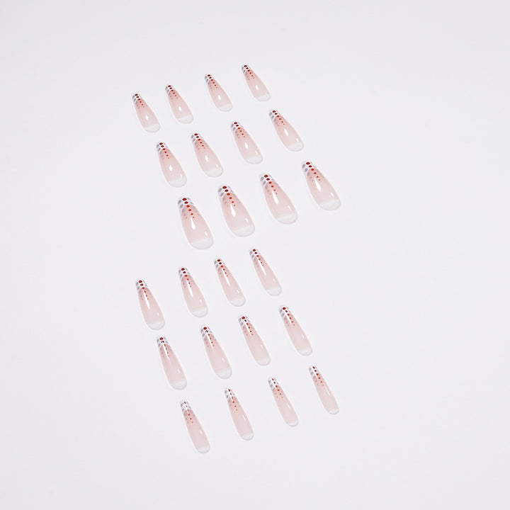 Kunstvolle Nagelverlängerungen mit eleganten Dots und schimmerndem Ombré Karnz