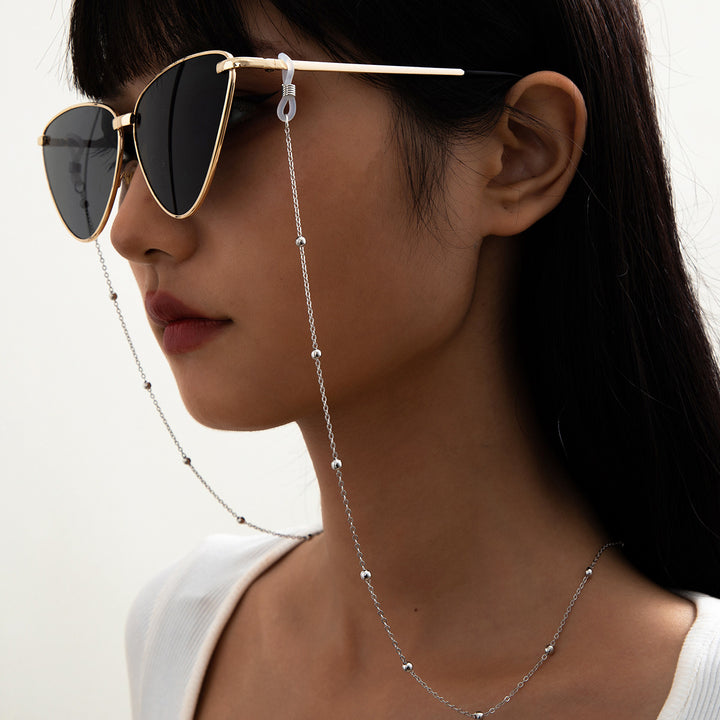 Stilsicheres Brillenband Aus Edelstahl mit Perlenförmigen Designelementen Karnz