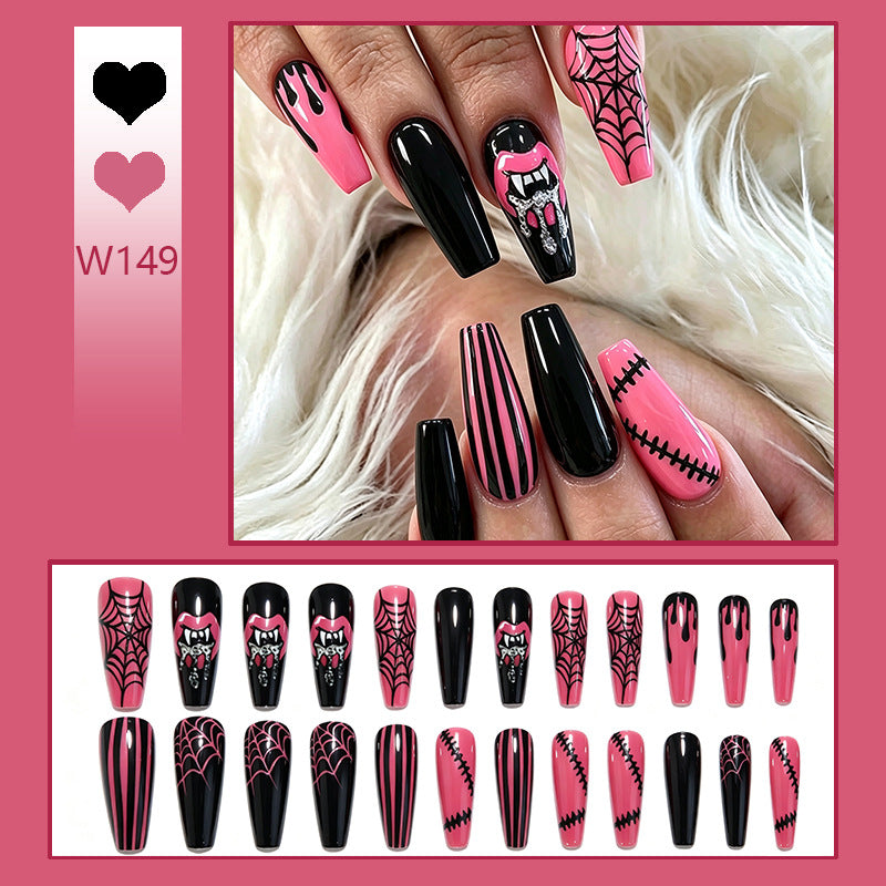 Kreatives Kunstnagelset mit Halloween-Motiven und funkelnden Applikationen Karnz