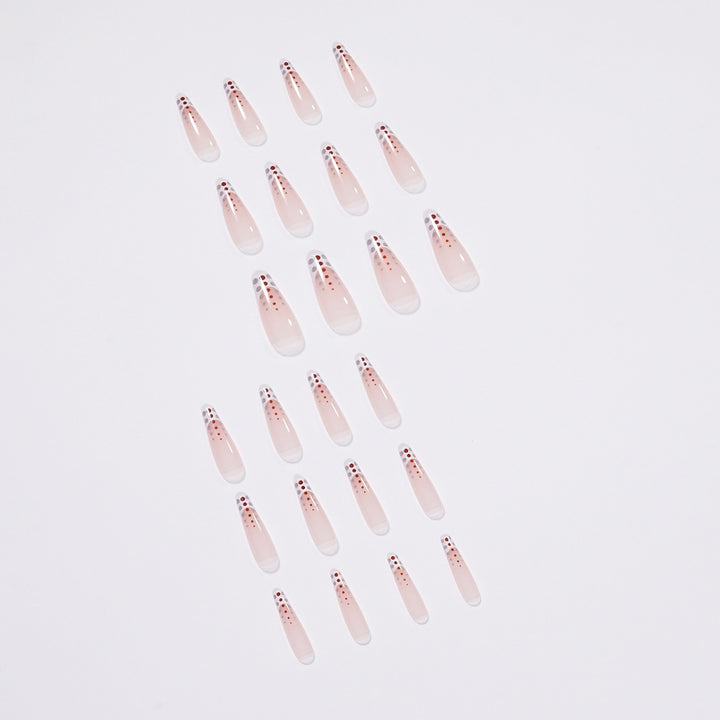 Kunstvolle Nagelverlängerungen mit eleganten Dots und schimmerndem Ombré Karnz