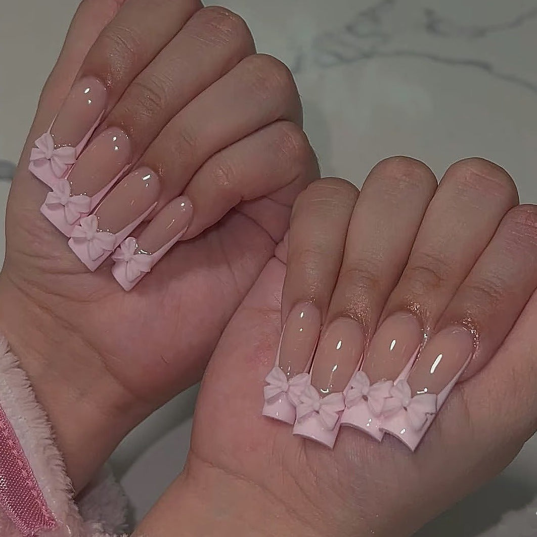 Kreatives Kunstnagelset mit Schleifenverzierungen Karnz