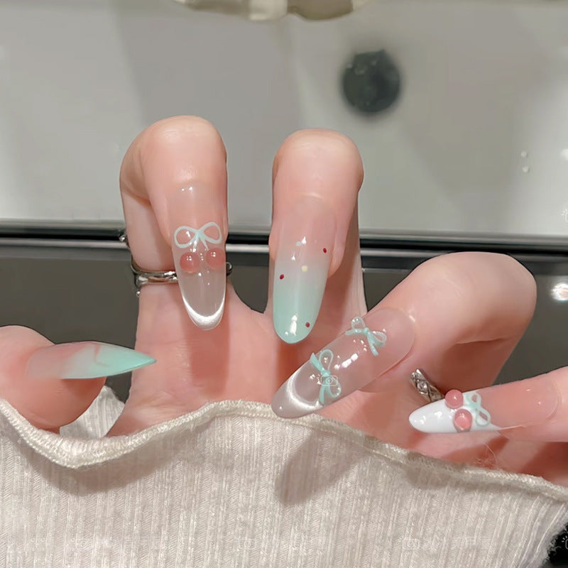 Kunstnagelset mit eleganten Schleifen- und Kirschen-Designs Karnz