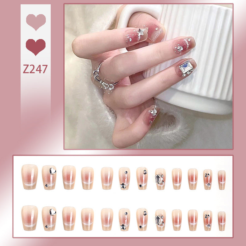 Kunstnagelset mit eleganten Glitzer- und Sternverzierungen Karnz