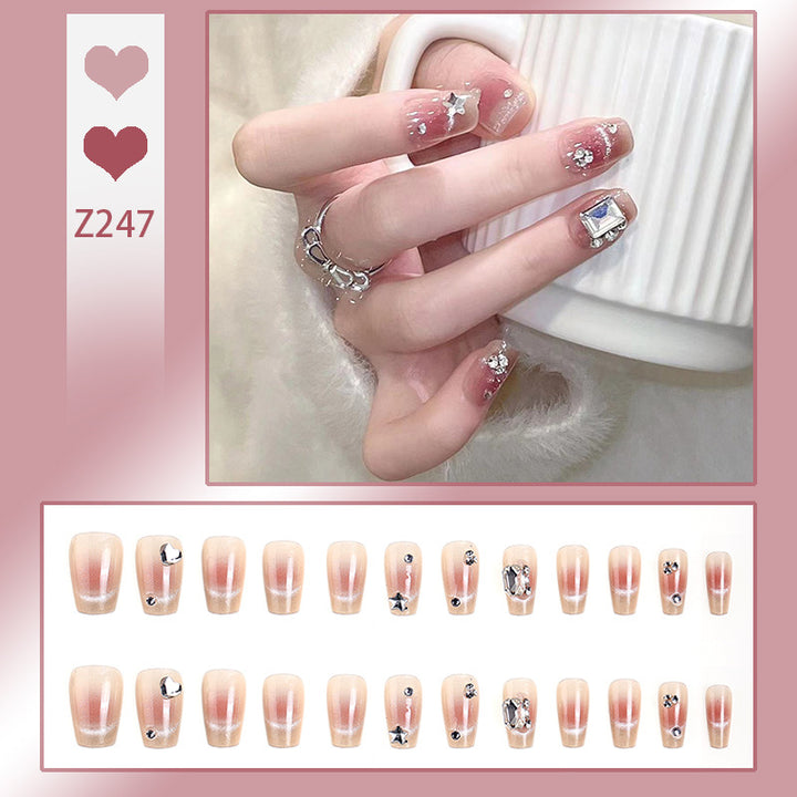 Kunstnagelset mit eleganten Glitzer- und Sternverzierungen Karnz