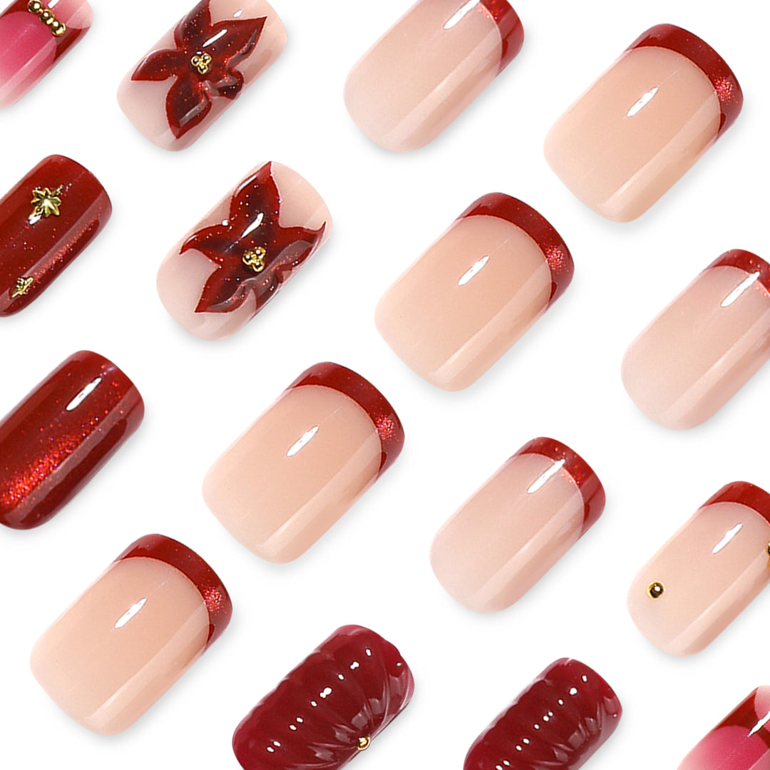 Kunstvolle Nagelgestaltung mit floralen und goldenen Akzenten Karnz