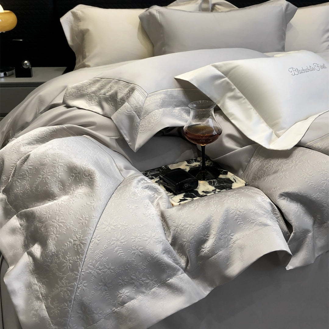 Jacquard floralgeprägte Baumwollsatin Bettwäsche Set mit geschwungenem besticktem Rand
