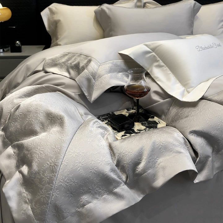 Jacquard floralgeprägte Baumwollsatin Bettwäsche Set mit geschwungenem besticktem Rand