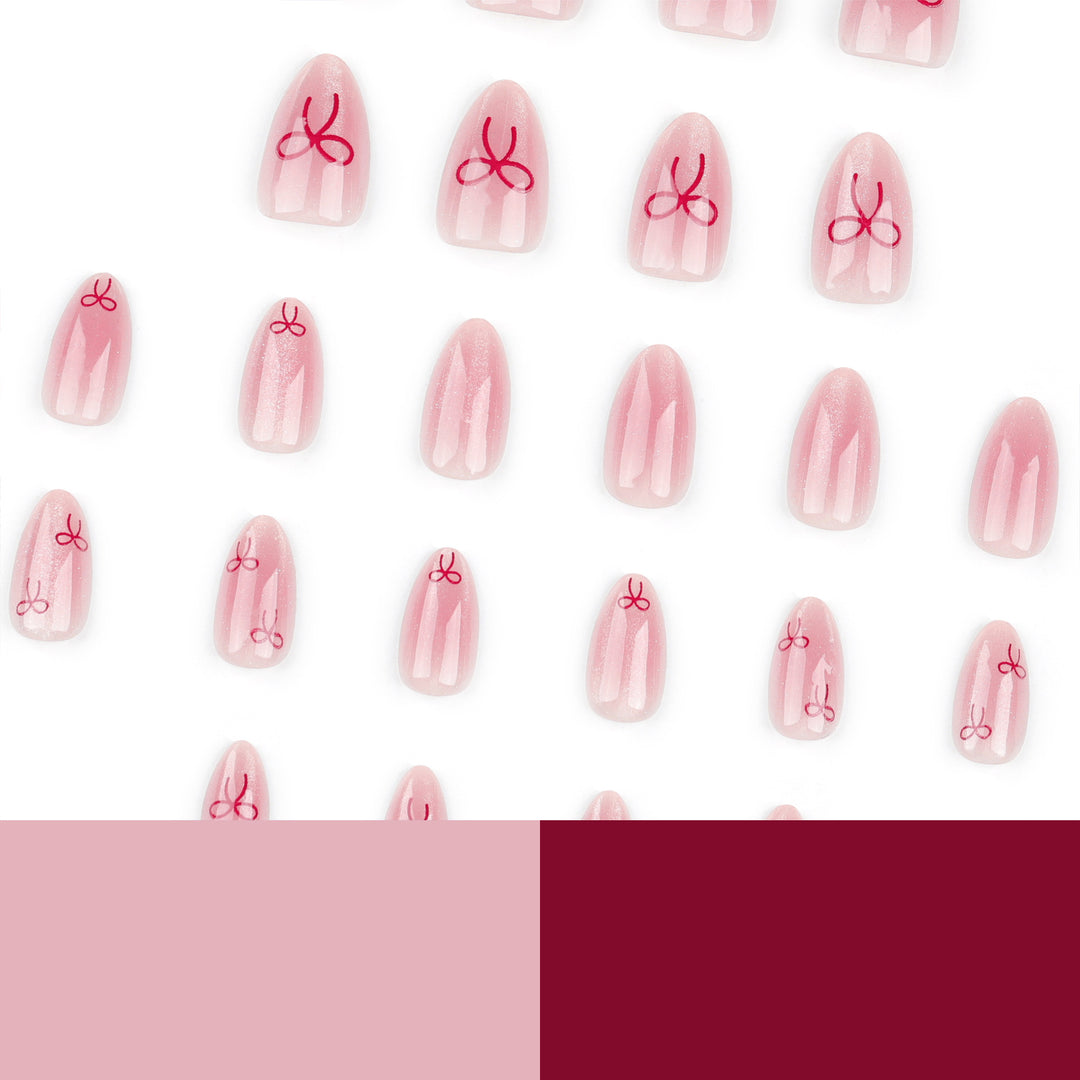 Künstliche Nagelkunst mit Schleifenmotiv Karnz
