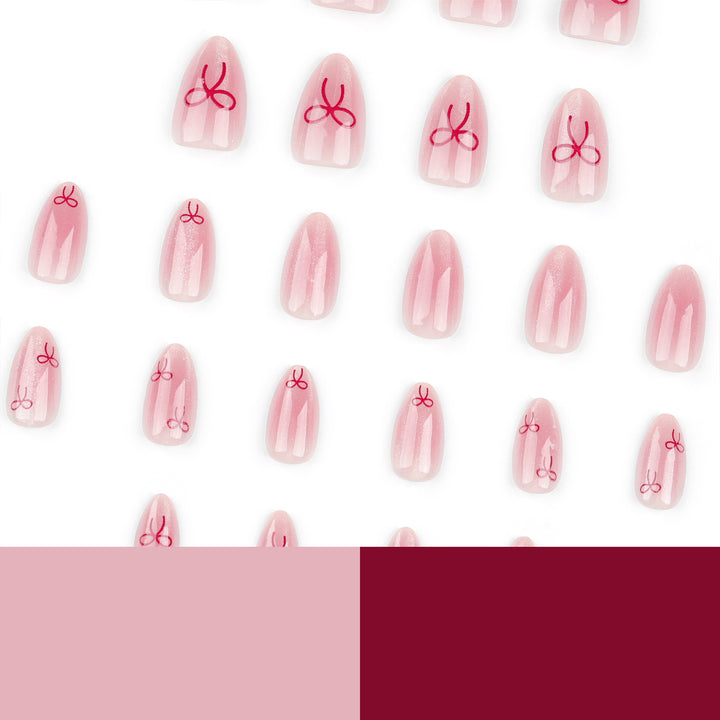 Künstliche Nagelkunst mit Schleifenmotiv Karnz