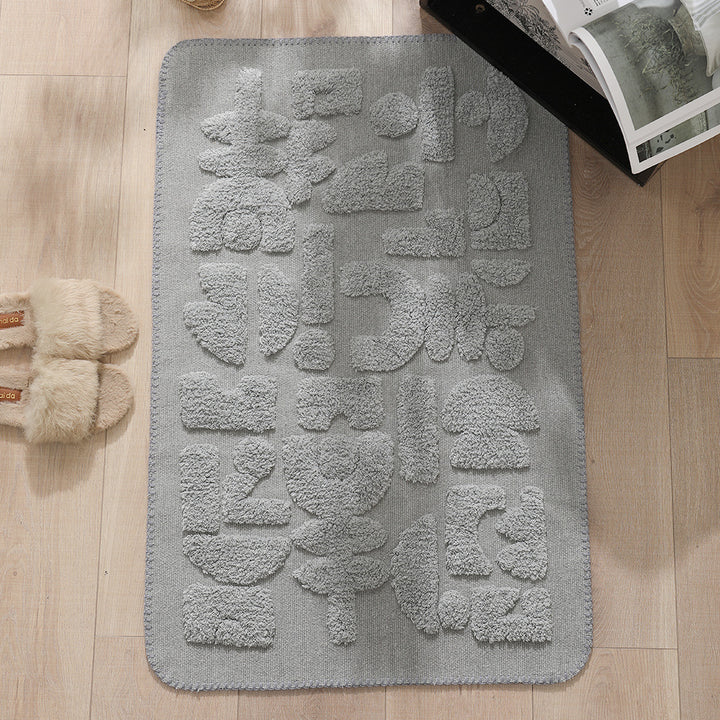 Rechteckige Baumwoll-Badematte mit abstraktem 3D‑Tuft‑Relief und rutschfester Rückseite