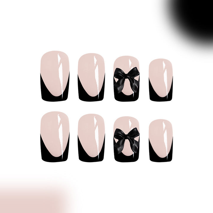 Kunstnagelset mit glamourösen Schleifenverzierungen Karnz
