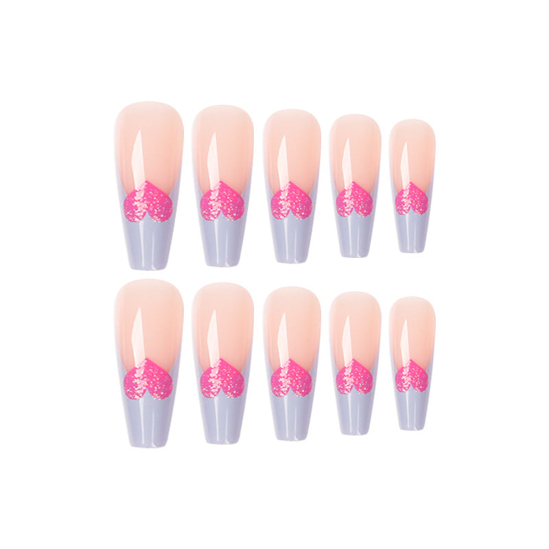 Kunstvolle Stiletto-Nägel mit bunten Herzmotiven Karnz