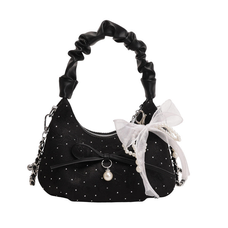 Elegante Schultertasche mit Schleifenverzierung